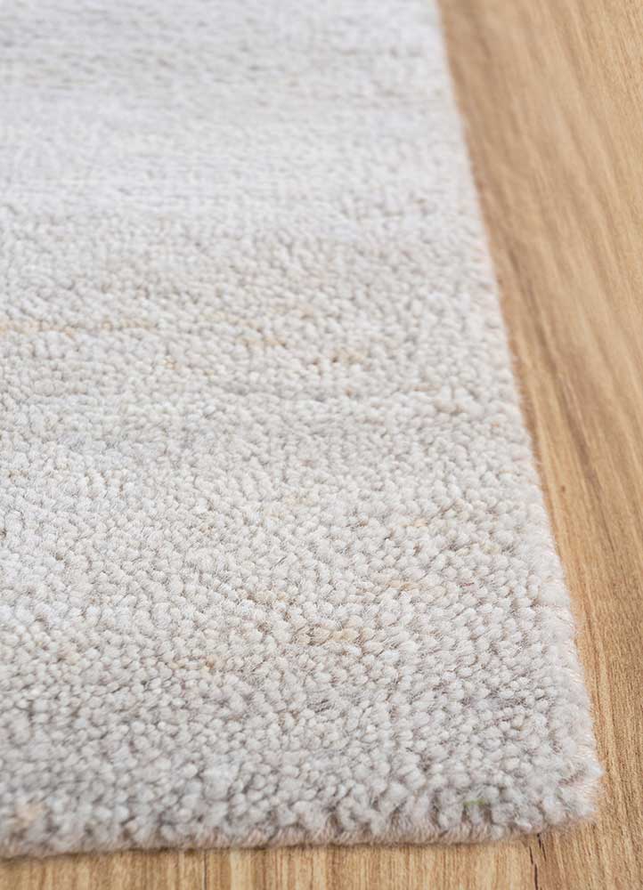 urban pause by kavi ivory wool and silk Hand Knotted Rug - Corner