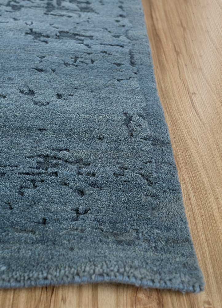 urban pause by kavi blue wool and silk Hand Knotted Rug - Corner