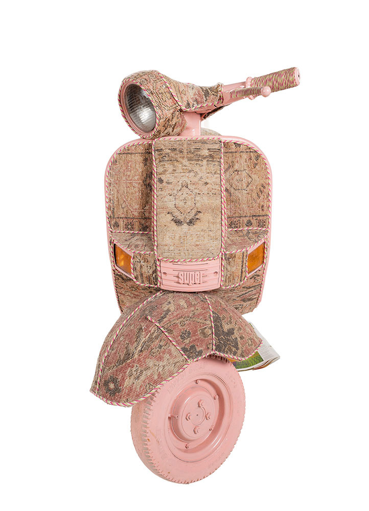  red and orange metal scooter frame and trims Vintage rug textile Rug